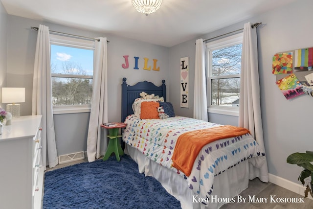 bedroom featuring multiple windows