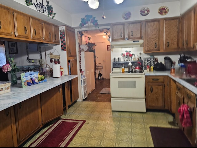 kitchen featuring white electric stove