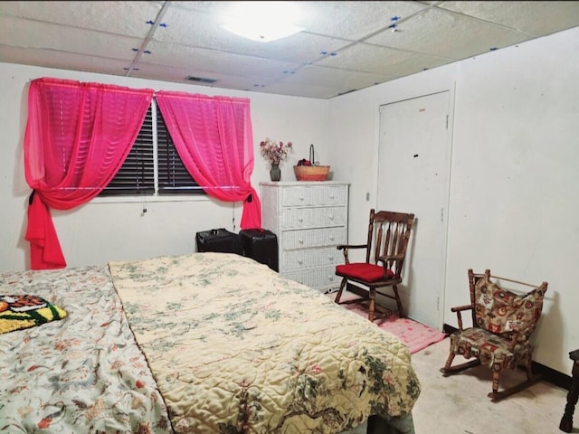 bedroom featuring a paneled ceiling