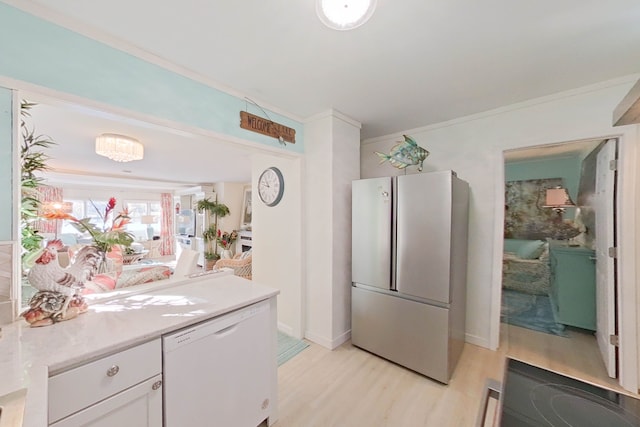 kitchen featuring white cabinetry, light hardwood / wood-style flooring, stainless steel refrigerator, ornamental molding, and dishwasher