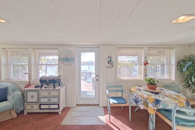 sunroom / solarium featuring wood ceiling