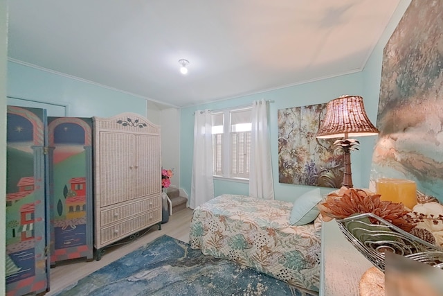 bedroom with crown molding