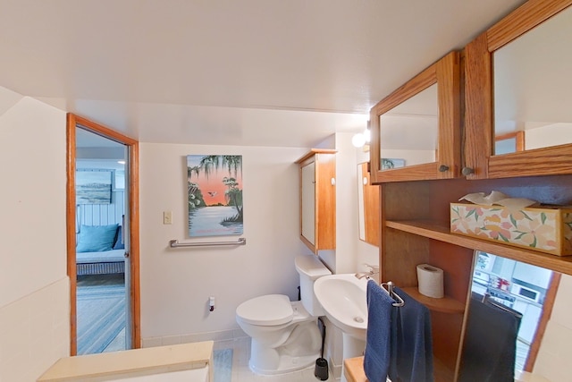 bathroom featuring sink and toilet