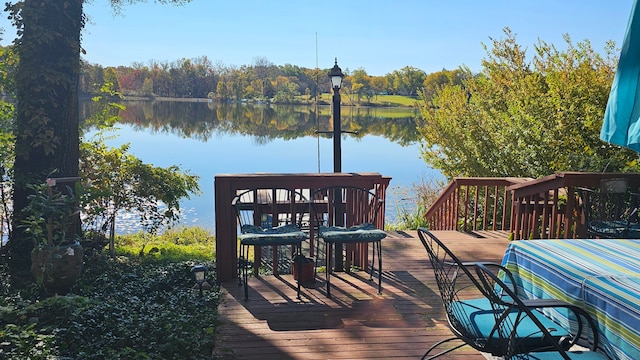 wooden deck featuring a water view