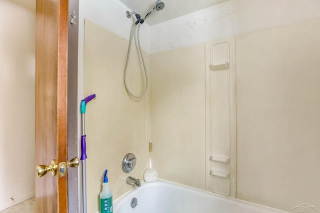 bathroom with bathing tub / shower combination