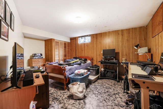 bedroom featuring wooden walls