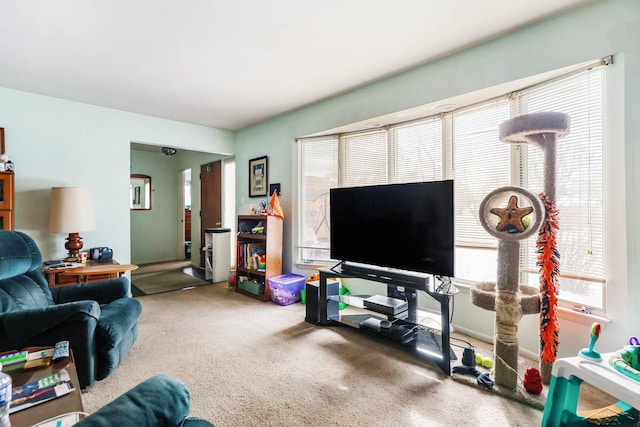 living room with carpet floors and a wealth of natural light