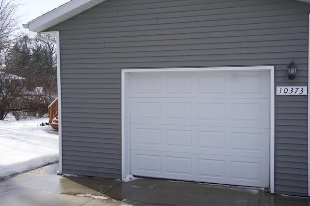 view of snow covered garage