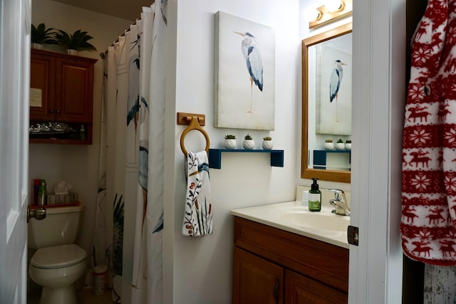 bathroom with vanity, toilet, and a shower with shower curtain