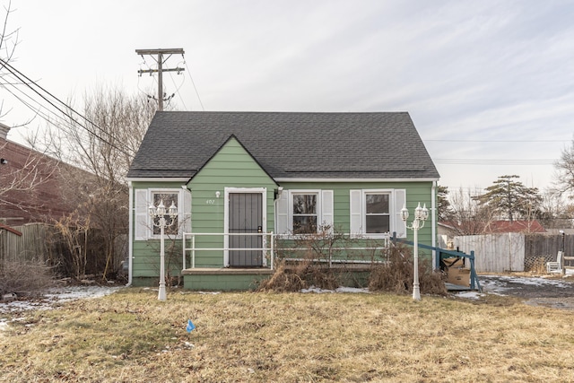 bungalow-style house with a front lawn