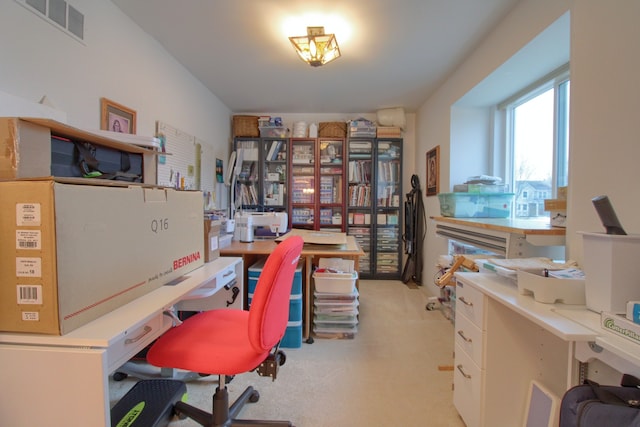 home office with light colored carpet