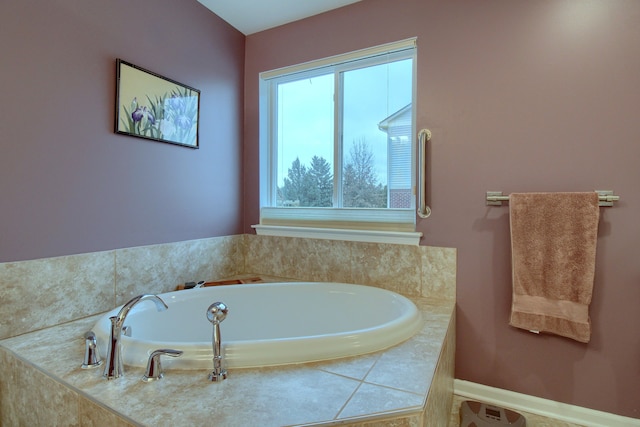 bathroom featuring tiled bath