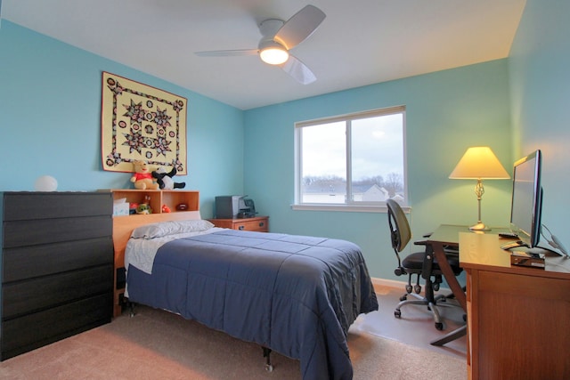 bedroom with ceiling fan and light colored carpet