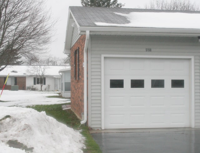 view of snow covered garage