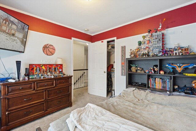 bedroom featuring light colored carpet and a closet