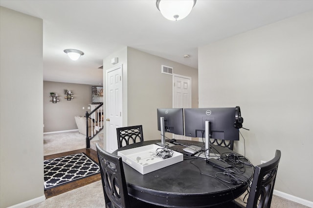 dining room featuring carpet flooring