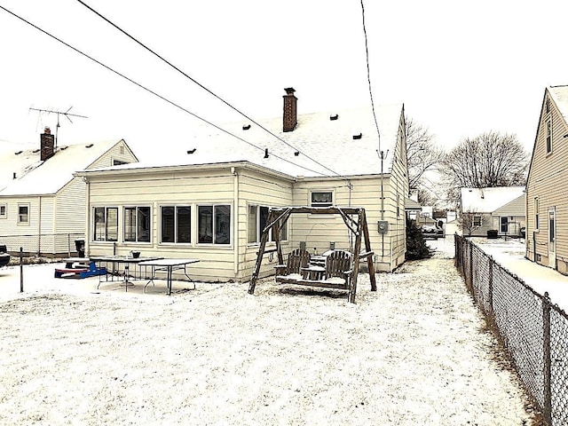 view of snow covered house