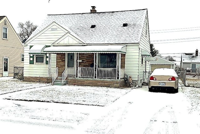 view of front facade with an outbuilding and a garage