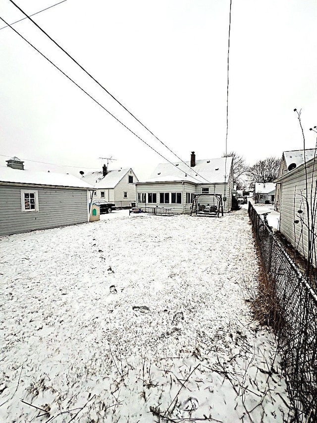 view of snow covered house