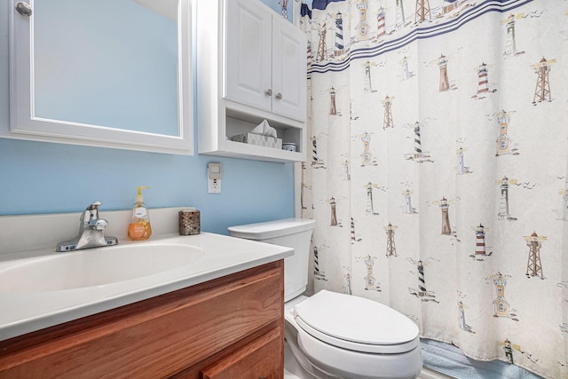 bathroom featuring vanity and toilet