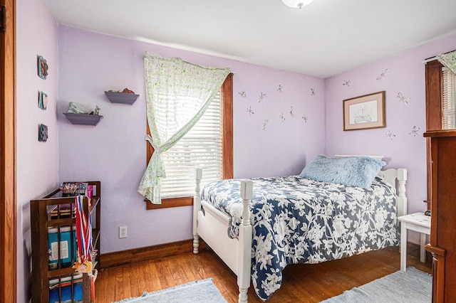 bedroom with hardwood / wood-style flooring