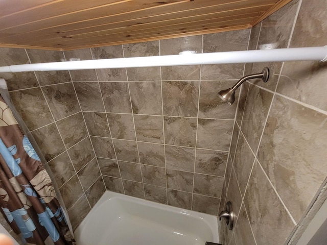 bathroom with shower / bath combo with shower curtain