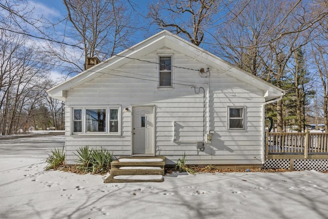 bungalow featuring a wooden deck