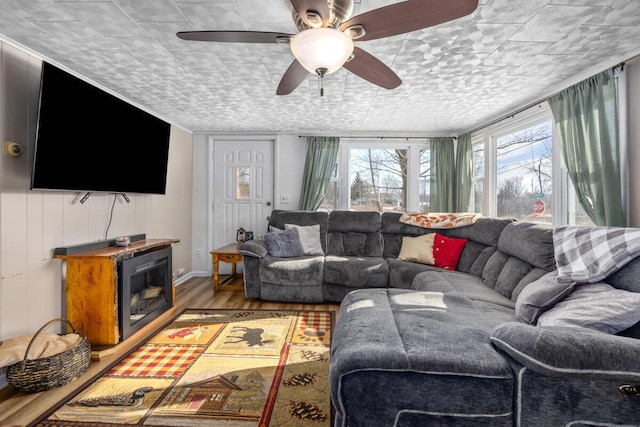 living room featuring hardwood / wood-style flooring and ceiling fan