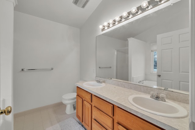 full bathroom with plus walk in shower, vanity, tile patterned floors, and toilet