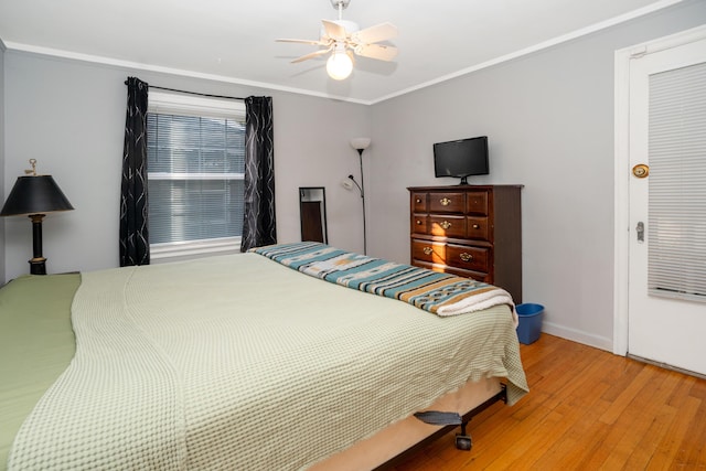 bedroom featuring crown molding, ceiling fan, and light hardwood / wood-style floors