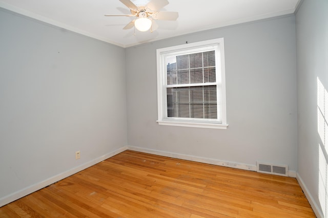 unfurnished room featuring crown molding, ceiling fan, and light hardwood / wood-style flooring