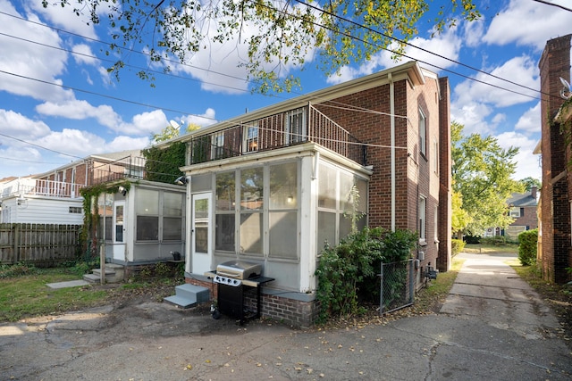 back of house with a sunroom