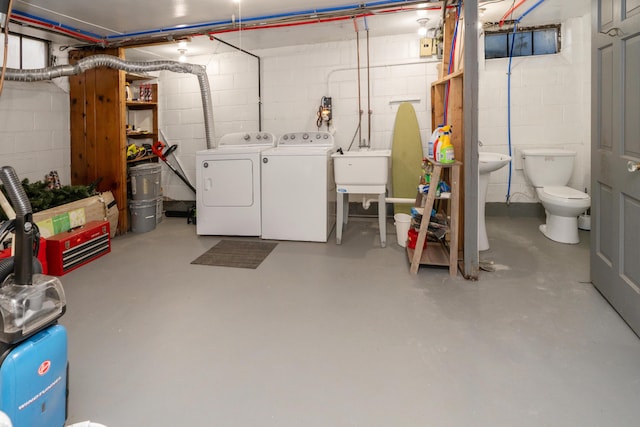 basement featuring sink and washing machine and dryer