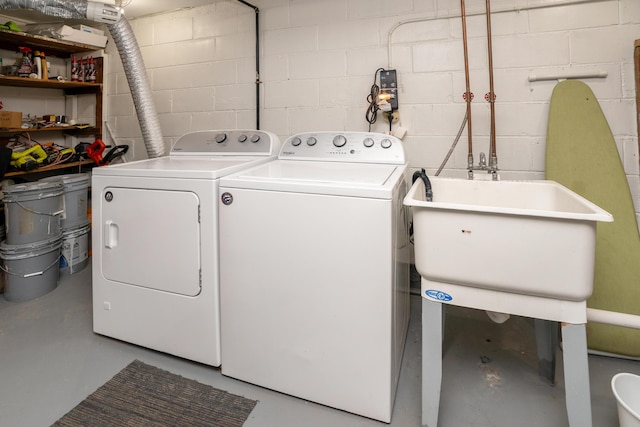 laundry area with sink and washer and clothes dryer