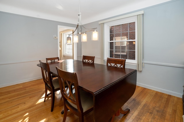 dining area featuring light wood-type flooring