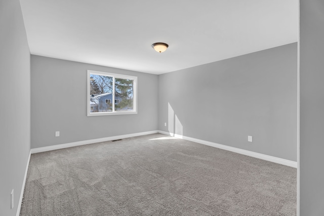 unfurnished room with carpet flooring