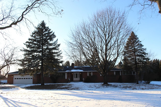 ranch-style home featuring a garage