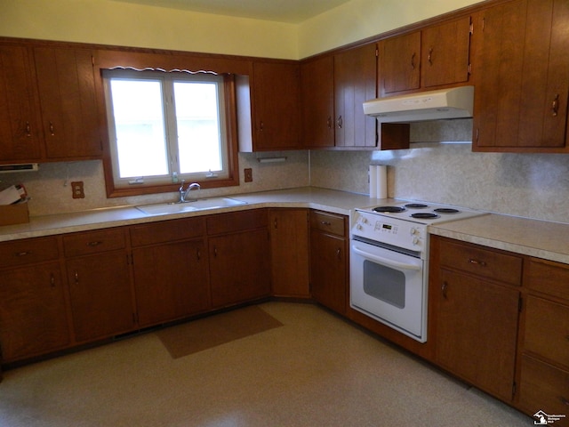 kitchen featuring white electric stove, sink, and backsplash