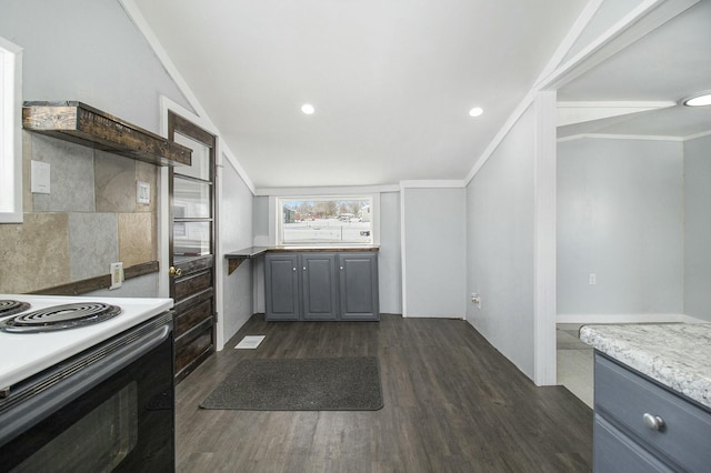 kitchen with electric range oven, dark wood-type flooring, and ornamental molding