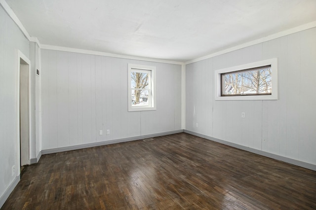 empty room featuring dark hardwood / wood-style flooring