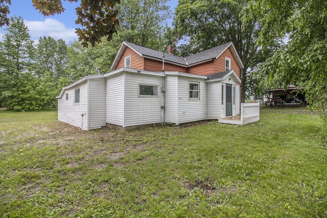 239 Laurel St, Walkerville, MI 49459 - view of side of home featuring a yard and a shingled roof