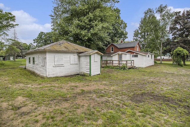 239 Laurel St, Walkerville, MI 49459 - view of grassy yard with a wooden deck and a storage unit