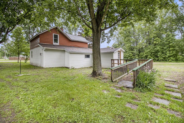 239 Laurel St, Walkerville, MI 49459 - view of side of property featuring a yard, a deck, and roof with shingles