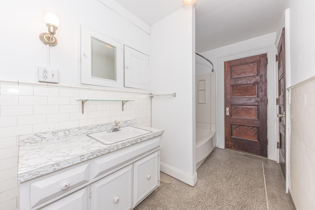 bathroom featuring vanity and washtub / shower combination