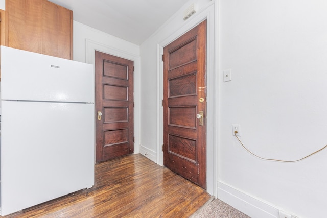 entrance foyer with dark hardwood / wood-style floors