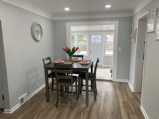 dining room with dark hardwood / wood-style floors