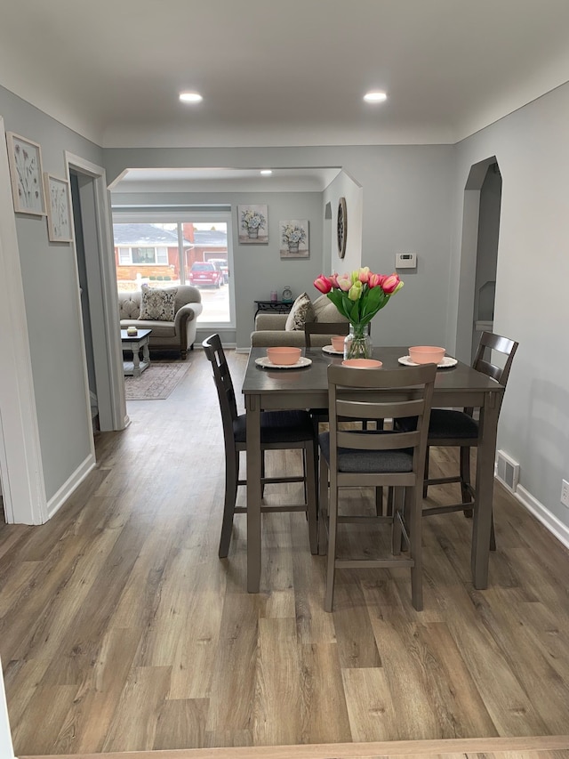 dining space featuring hardwood / wood-style floors