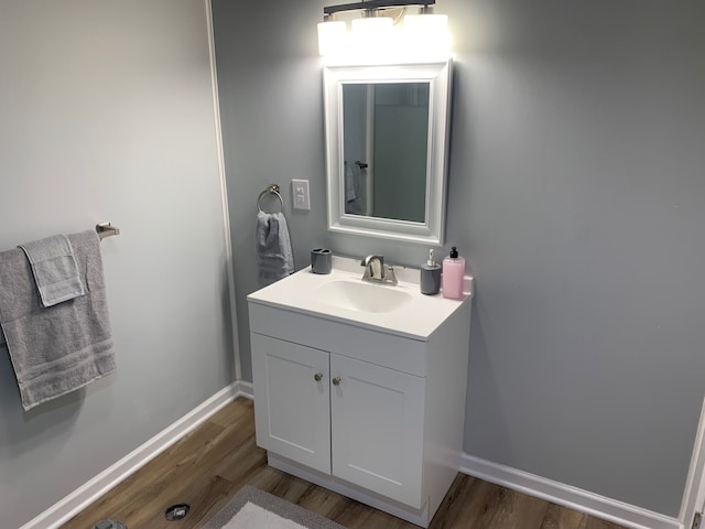 bathroom featuring vanity and wood-type flooring