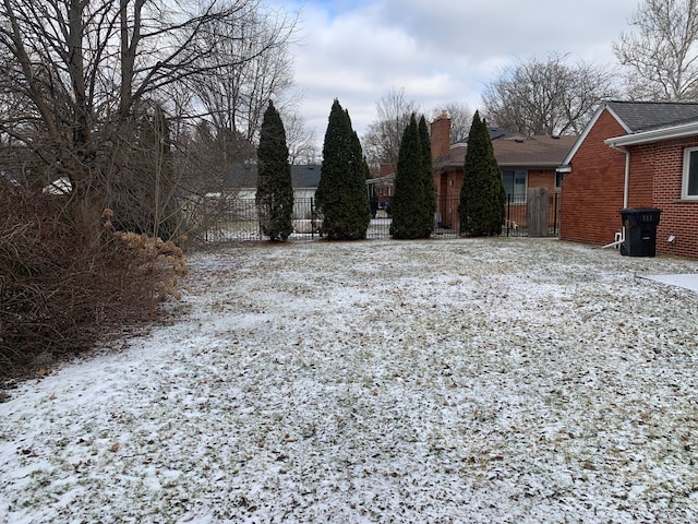 view of yard layered in snow