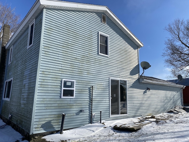 view of snow covered property